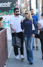 NICOLA PELTZ and Brooklyn Beckham Out Shopping on Abbot Kinney in Venice Beach 02/11/2022