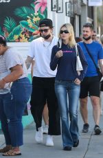 NICOLA PELTZ and Brooklyn Beckham Out Shopping on Abbot Kinney in Venice Beach 02/11/2022