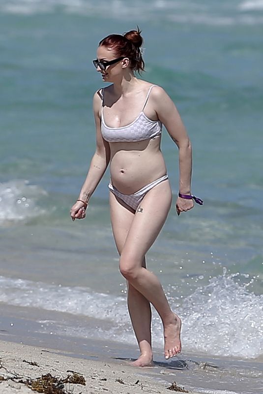 Pregnant SOPHIE TURNER in Bikni on the Beach in Miami 02/27/2022