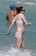 Pregnant SOPHIE TURNER in Bikni on the Beach in Miami 02/27/2022