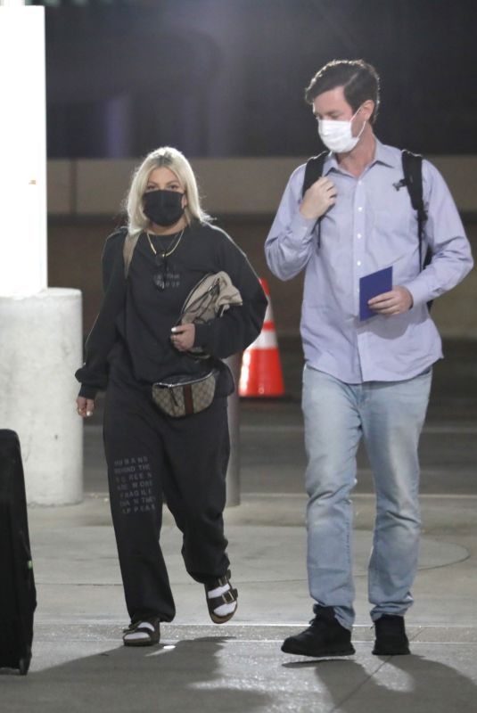 TORI SPELLING at LAX Airport in Los Angeles 02/13/2022