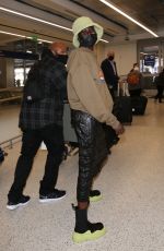 ALEX WEK at LAX Airport in Los Angeles 03/09/2022