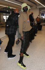 ALEX WEK at LAX Airport in Los Angeles 03/09/2022