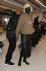 ALEX WEK at LAX Airport in Los Angeles 03/09/2022