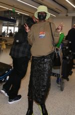 ALEX WEK at LAX Airport in Los Angeles 03/09/2022