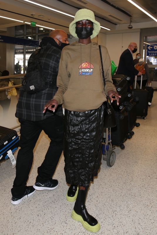 ALEX WEK at LAX Airport in Los Angeles 03/09/2022