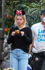 DAKOTA JOHNSON Out with Friends at Disneyland in Anaheim 03/02/2022