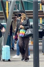 DELTA GOODREM Arrives at Airport in Perth 03/21/2022