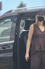 DELTA GOODREM Arrives at Airport in Perth 03/21/2022