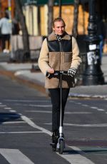 DIENA KRUGER Out Riding and E-scooter in New York 03/02/2022
