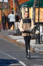 DIENA KRUGER Out Riding and E-scooter in New York 03/02/2022