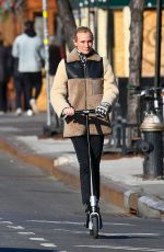 DIENA KRUGER Out Riding and E-scooter in New York 03/02/2022