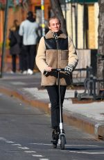 DIENA KRUGER Out Riding and E-scooter in New York 03/02/2022