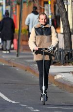 DIENA KRUGER Out Riding and E-scooter in New York 03/02/2022
