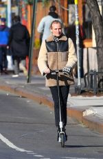 DIENA KRUGER Out Riding and E-scooter in New York 03/02/2022