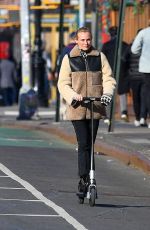 DIENA KRUGER Out Riding and E-scooter in New York 03/02/2022