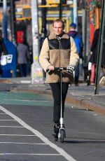 DIENA KRUGER Out Riding and E-scooter in New York 03/02/2022