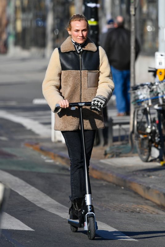 DIENA KRUGER Out Riding and E-scooter in New York 03/02/2022
