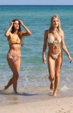 JOY and GINA CORRIGAN in Bikinis at a Beach in Miami 03/29/2022