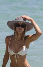 JOY CORRIGAN in Bikini at a Beach in Miami 03/29/2022