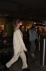 KATE BECKINSALE Arrives at LAX Airport in Los Angeles 03/13/2022