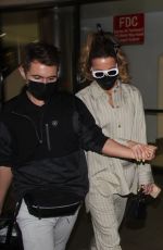 KATE BECKINSALE Arrives at LAX Airport in Los Angeles 03/13/2022