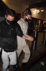 KATE BECKINSALE Arrives at LAX Airport in Los Angeles 03/13/2022