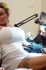KATIE PRICE Getting Her Second Tattoo on Holiday in Thailand 03/14/2022