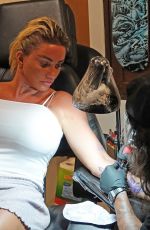 KATIE PRICE Getting Her Second Tattoo on Holiday in Thailand 03/14/2022
