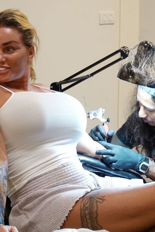 KATIE PRICE Getting Her Second Tattoo on Holiday in Thailand 03/14/2022