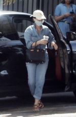 KATY PERRY in a Denim Jumpsuit Visits a Friend in Los Angeles 03/25/2022