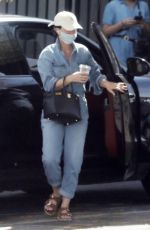 KATY PERRY in a Denim Jumpsuit Visits a Friend in Los Angeles 03/25/2022