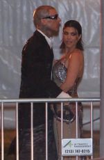 KOURTNEY KARDASHIAN and Travis Barker Leaves Vanity Fair Oscar Party in Beverly Hills 03/27/2022