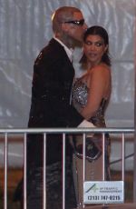 KOURTNEY KARDASHIAN and Travis Barker Leaves Vanity Fair Oscar Party in Beverly Hills 03/27/2022