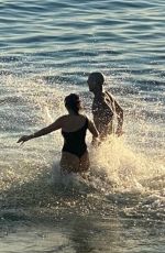 KOURTNEY KARDASHIAN and Travis Barker on the Beach in Laguna Beach 03/10/2022