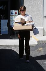 LUCY HALE Picks up a Load of Packages at UPS in Los Angeles 03/16/2022