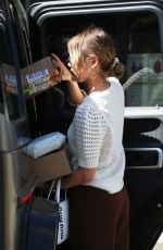 LUCY HALE Picks up a Load of Packages at UPS in Los Angeles 03/16/2022