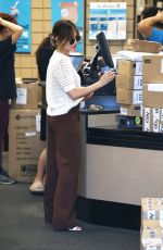 LUCY HALE Picks up a Load of Packages at UPS in Los Angeles 03/16/2022