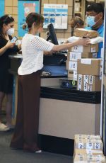 LUCY HALE Picks up a Load of Packages at UPS in Los Angeles 03/16/2022