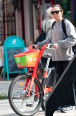 MELANIE CHISHOLM Out for a Bike Ride in London 03/23/2022