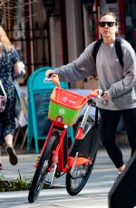 MELANIE CHISHOLM Out for a Bike Ride in London 03/23/2022