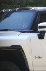 MILA KUNIS and Ashton Kutcher Out in His Electric Hummer in Los Angeles 03/14/2022