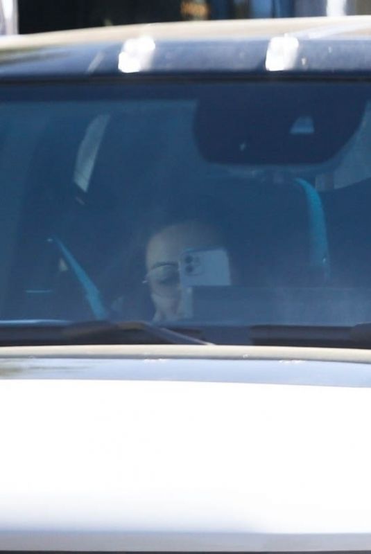 MILA KUNIS and Ashton Kutcher Out in His Electric Hummer in Los Angeles 03/14/2022