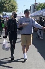 NICOLA PELTZ and Brooklyn Beckham at a Farmers Market in West Hollywood 03/06/2022