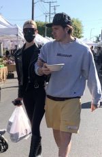NICOLA PELTZ and Brooklyn Beckham at a Farmers Market in West Hollywood 03/06/2022