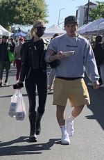 NICOLA PELTZ and Brooklyn Beckham at a Farmers Market in West Hollywood 03/06/2022