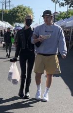 NICOLA PELTZ and Brooklyn Beckham at a Farmers Market in West Hollywood 03/06/2022