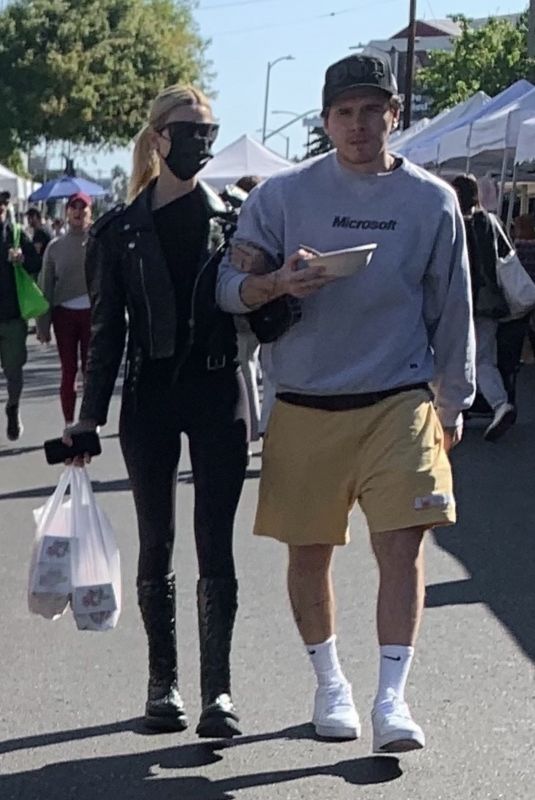 NICOLA PELTZ and Brooklyn Beckham at a Farmers Market in West Hollywood 03/06/2022