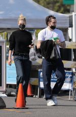 NICOLA PELTZ and Brooklyn Beckham Out at Beverly Hills Farmers Market 03/13/2022