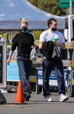 NICOLA PELTZ and Brooklyn Beckham Out at Beverly Hills Farmers Market 03/13/2022